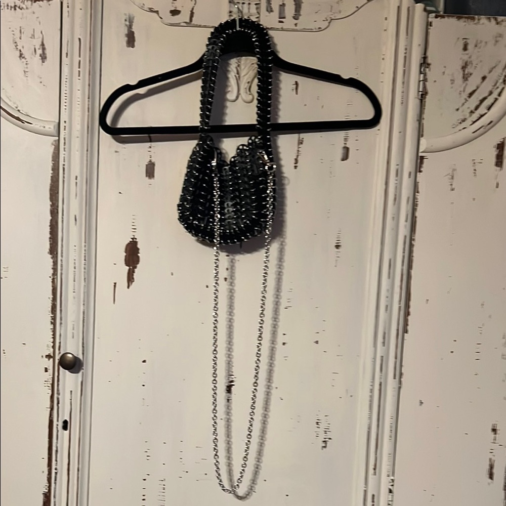 Elegant Black and Silver Textured Handbag with Delicate Chain